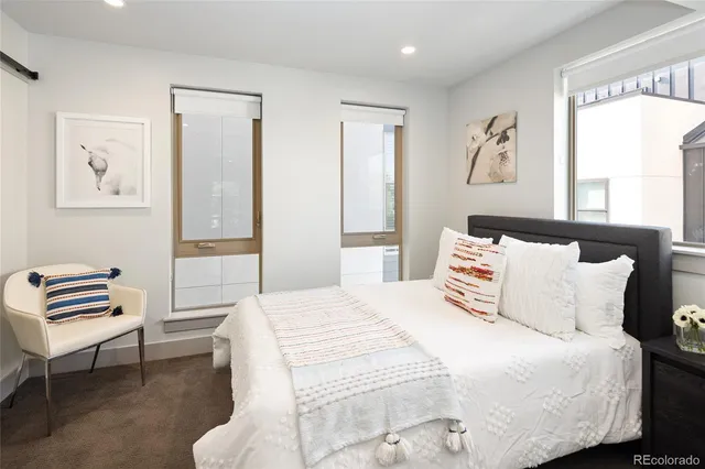 a bedroom with a bed and a closet