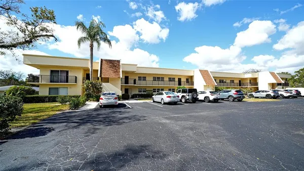 a view of room with hardwood floor and window