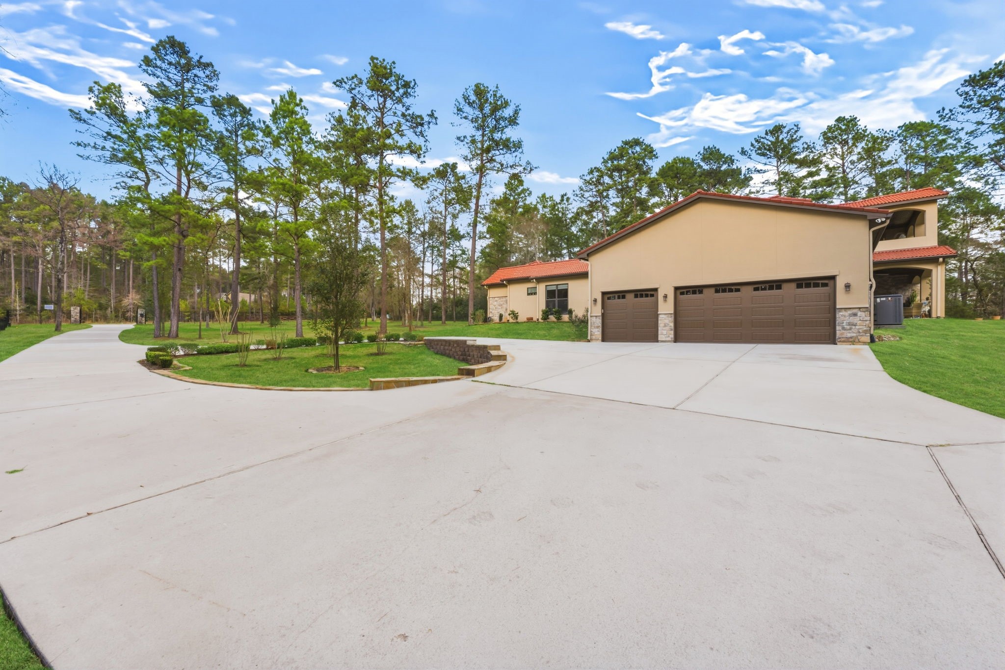 280 Sundog Road Huntsville, TX 77340 - Photo 46 of 50 Circular driveway provides convenient access and easy entry and exit while leading to the attached three-car garage. MAJOR SYSTEM UPGRADE: 3 NEW HVAC systems with dehumidifiers installed in 2023.