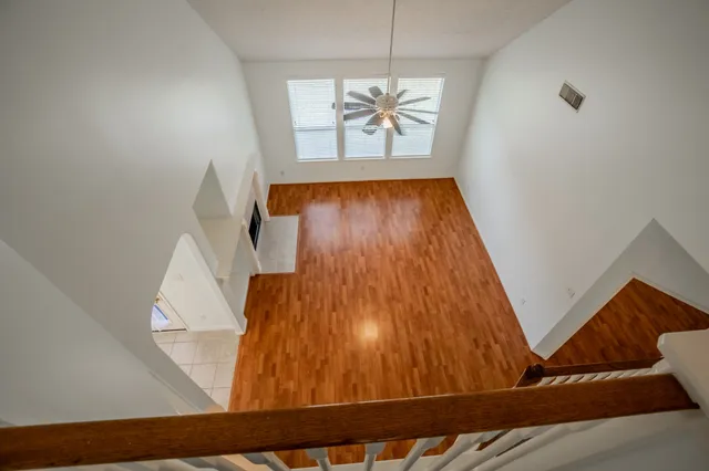 a view of an entryway with wooden floor