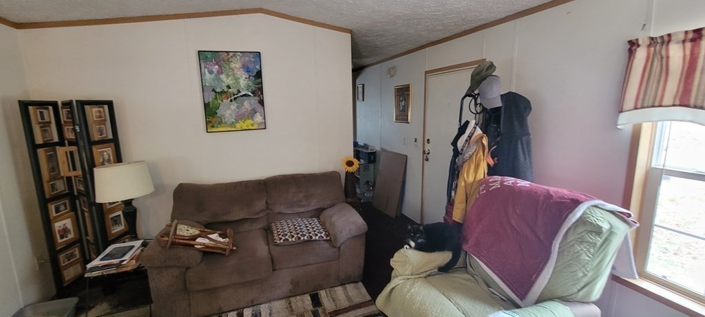 166 Lower Gore Road Webster, MA 01570 - Photo 15 of 23 a living room with furniture rug and a window