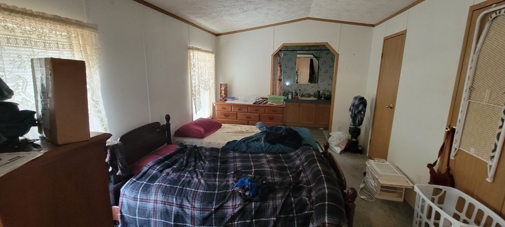 166 Lower Gore Road Webster, MA 01570 - Photo 8 of 23 a living room with furniture and a mirror