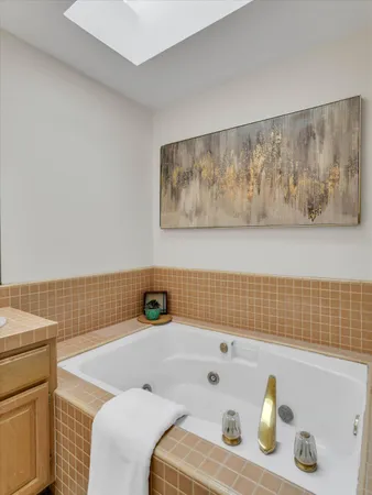 a bathroom with a bathtub and shower