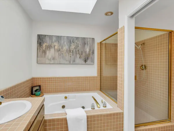 a bathroom with a bathtub and shower