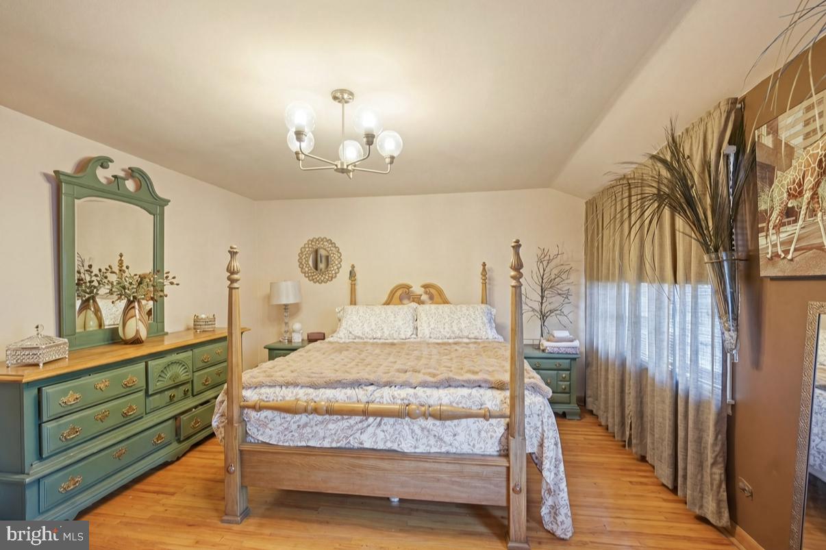 24 Castor Court Sewell, NJ 08080 - Photo 12 of 19 a bedroom with a bed and a mirror on the dresser