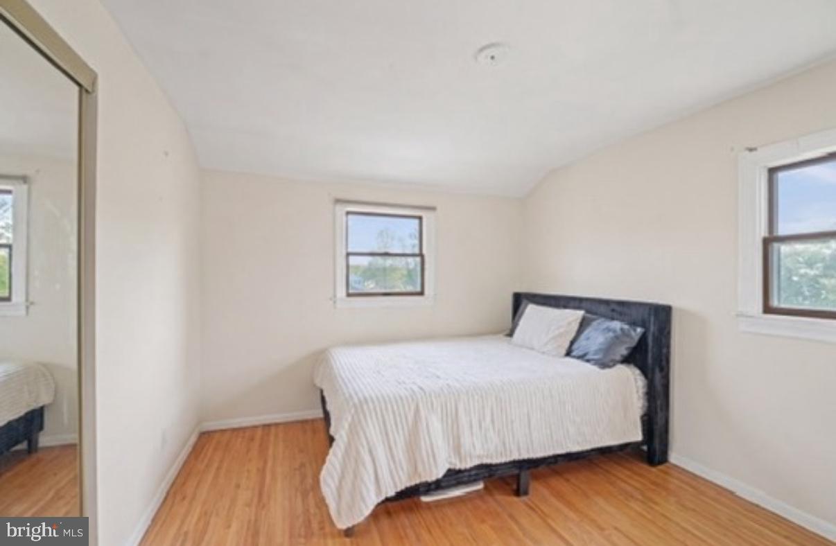 24 Castor Court Sewell, NJ 08080 - Photo 16 of 19 a bedroom with a bed and wooden floor