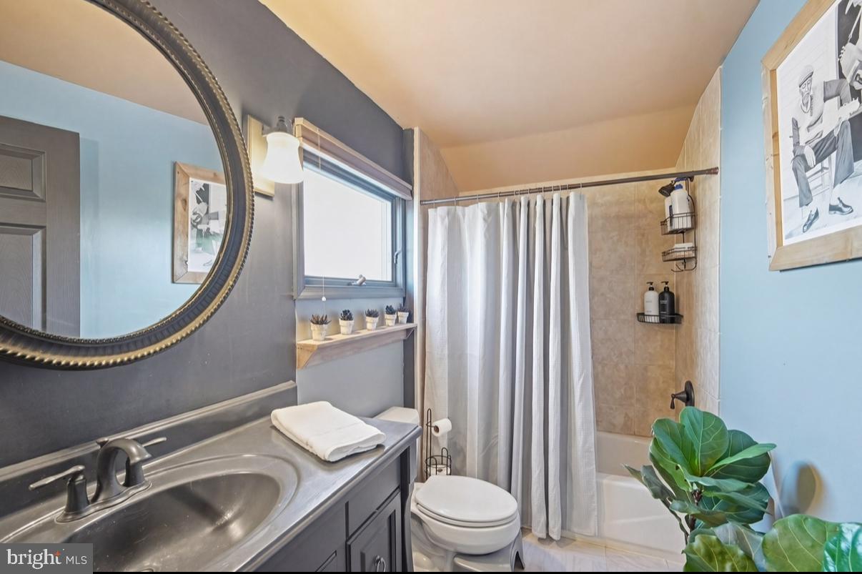 24 Castor Court Sewell, NJ 08080 - Photo 10 of 19 a bathroom with a sink a toilet and a mirror