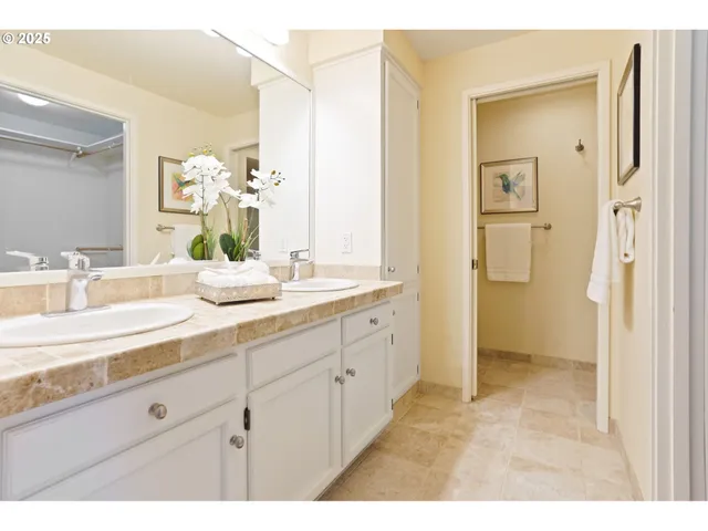 a bathroom with a granite countertop sink mirror and a