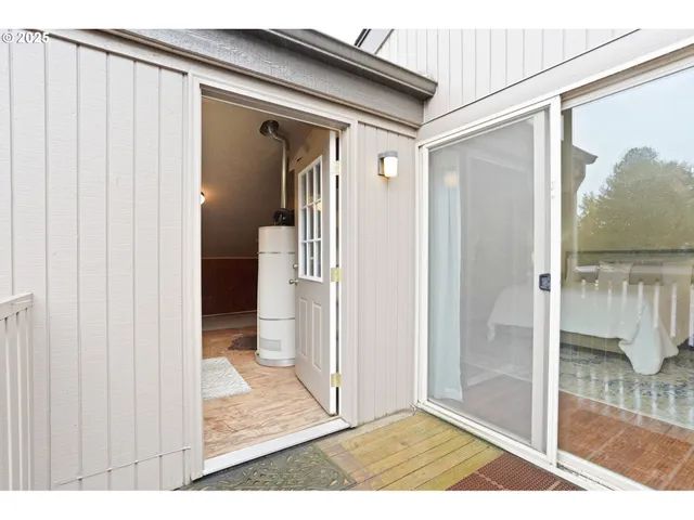 a view of a front door and wooden floor