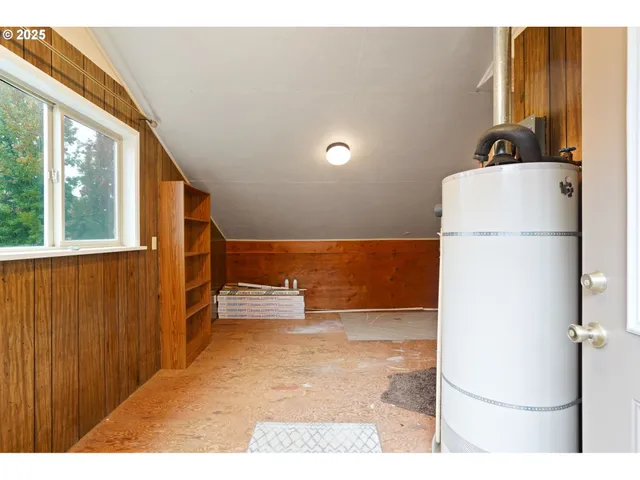 a kitchen with a refrigerator and a more cabinets