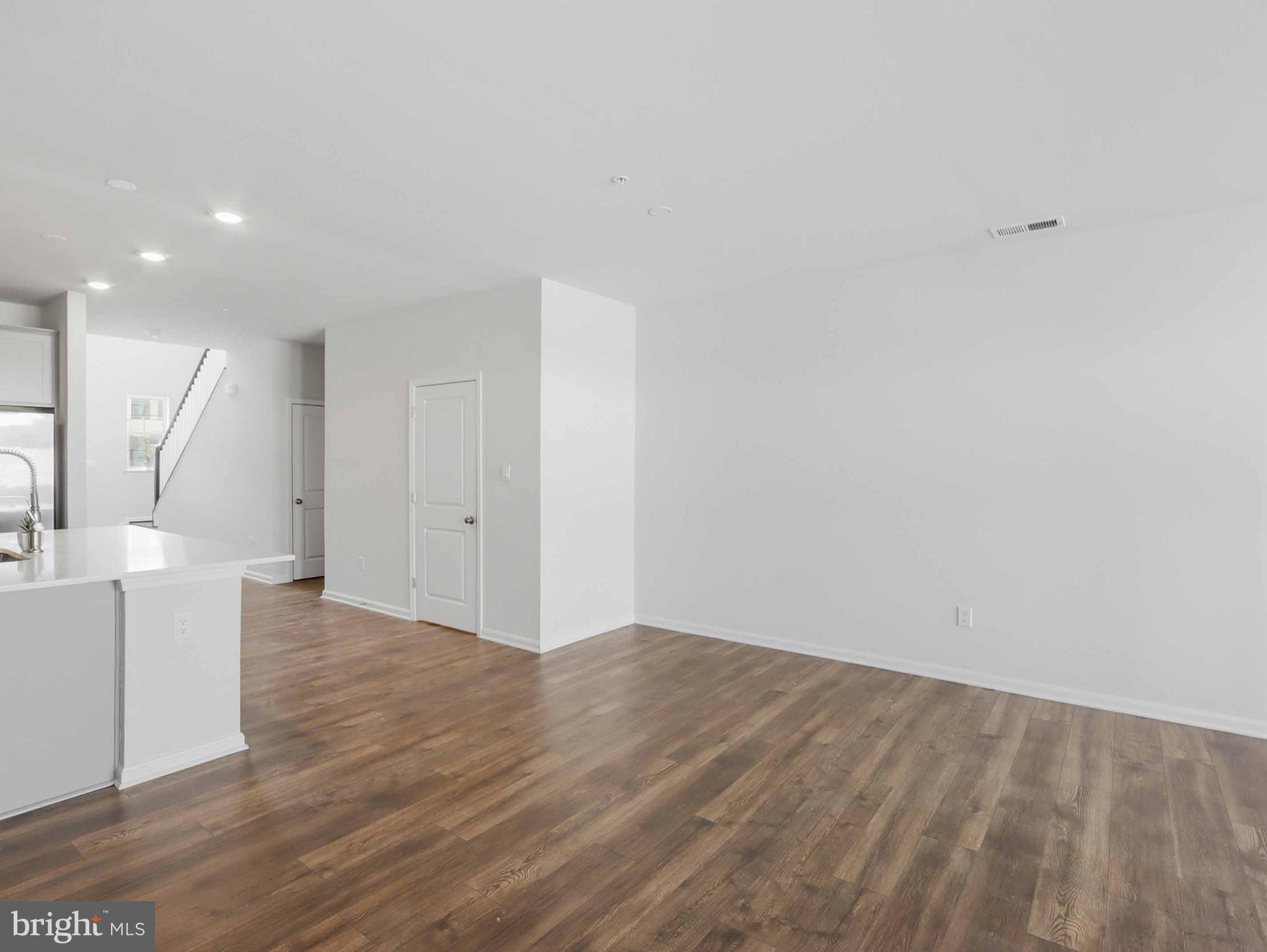 485 Hanson Street Frederick, MD 21701 - Photo 14 of 48 a view of an empty room with wooden floor