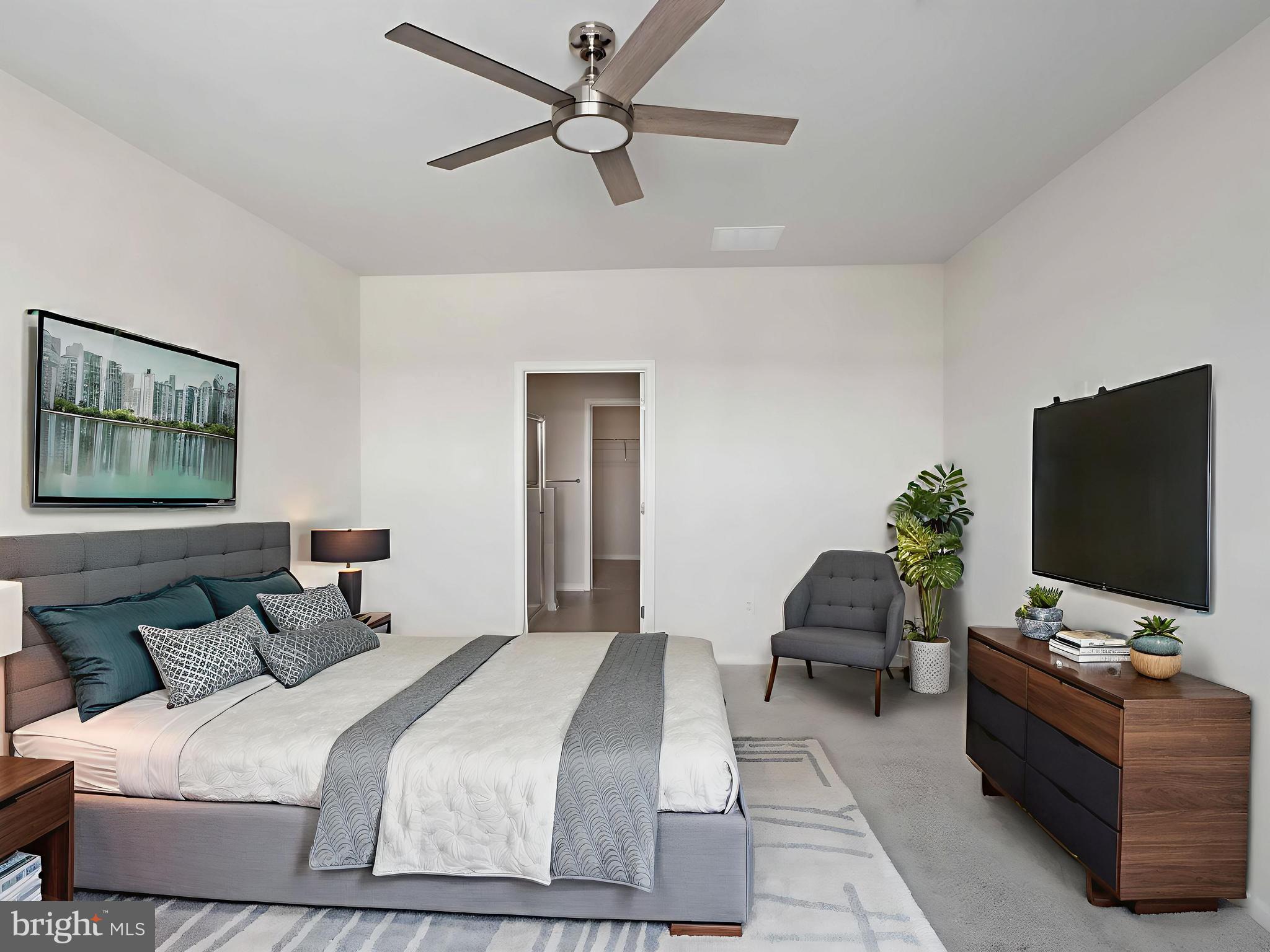 485 Hanson Street Frederick, MD 21701 - Photo 15 of 48 a bedroom with a bed and a flat screen tv