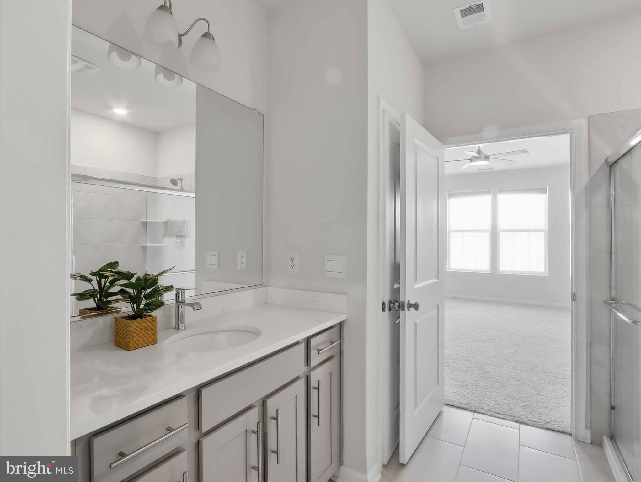 485 Hanson Street Frederick, MD 21701 - Photo 18 of 48 a bathroom with a sink a mirror and a shower