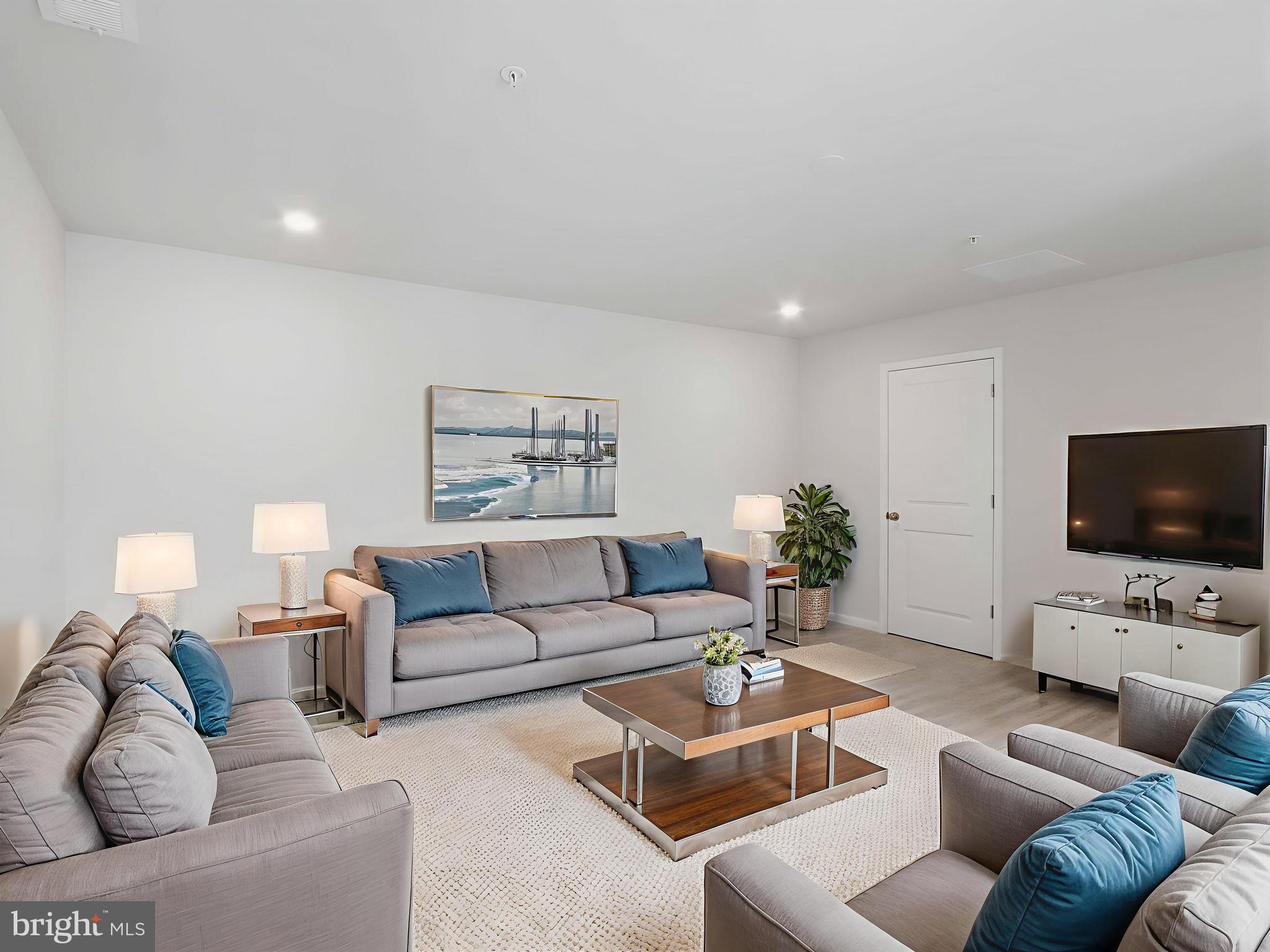 485 Hanson Street Frederick, MD 21701 - Photo 22 of 48 a living room with furniture and a flat screen tv