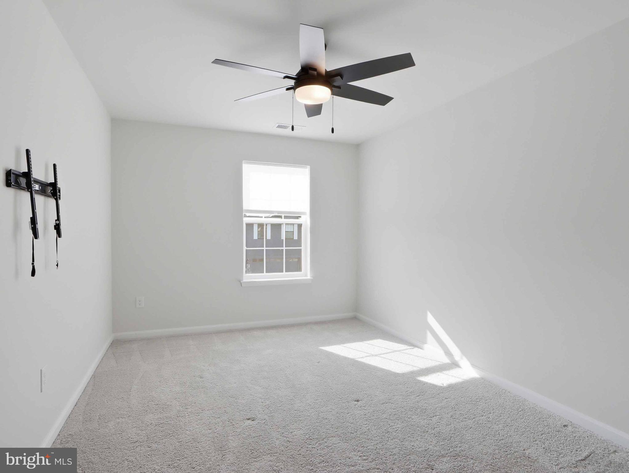 485 Hanson Street Frederick, MD 21701 - Photo 26 of 48 an empty room with a window and a fan