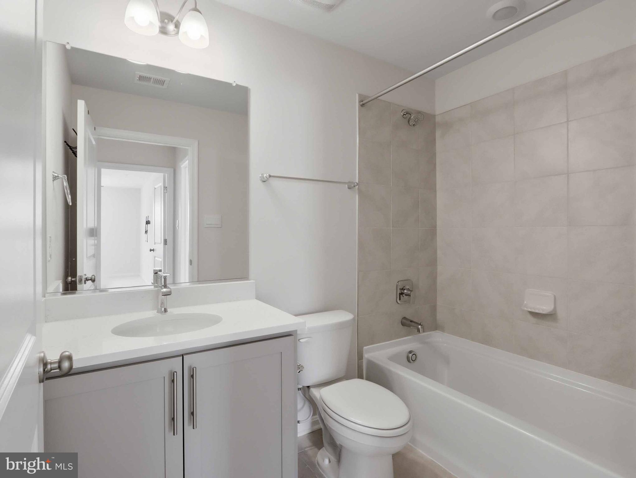 485 Hanson Street Frederick, MD 21701 - Photo 27 of 48 a bathroom with a sink a toilet and shower