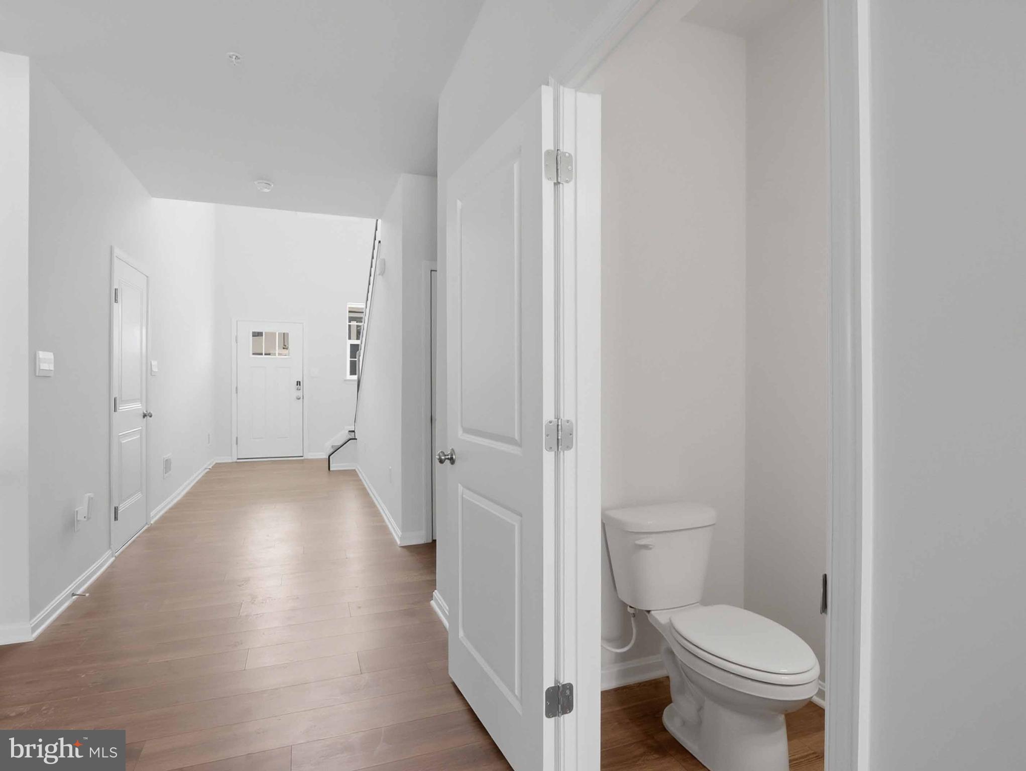 485 Hanson Street Frederick, MD 21701 - Photo 5 of 48 a bathroom with a granite countertop toilet and a sink