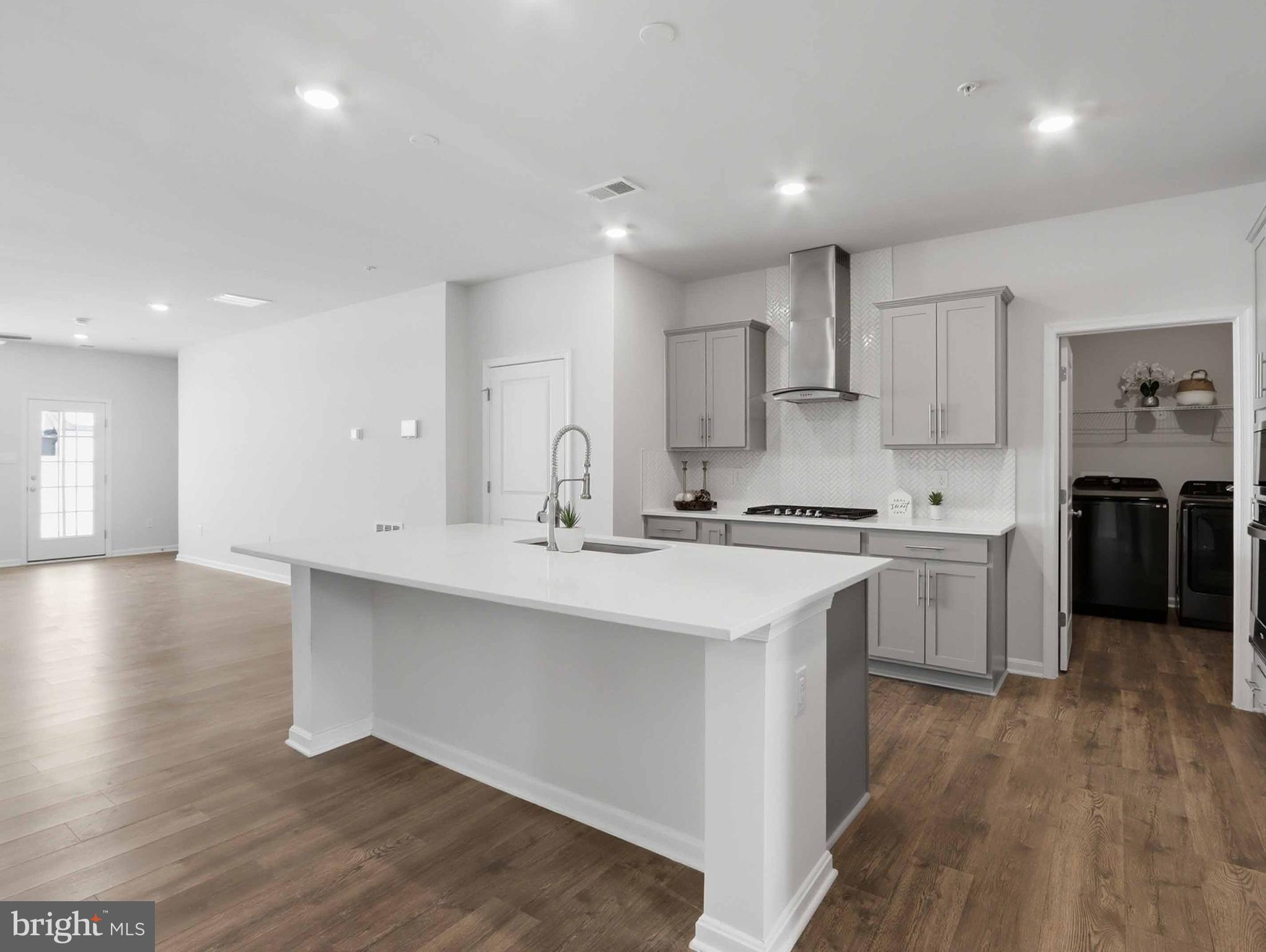 485 Hanson Street Frederick, MD 21701 - Photo 6 of 48 a kitchen with a sink white cabinets and stainless steel appliances