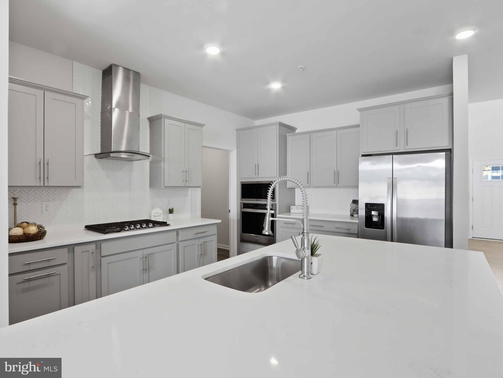 485 Hanson Street Frederick, MD 21701 - Photo 8 of 48 a kitchen with stainless steel appliances granite countertop a sink a stove and a refrigerator