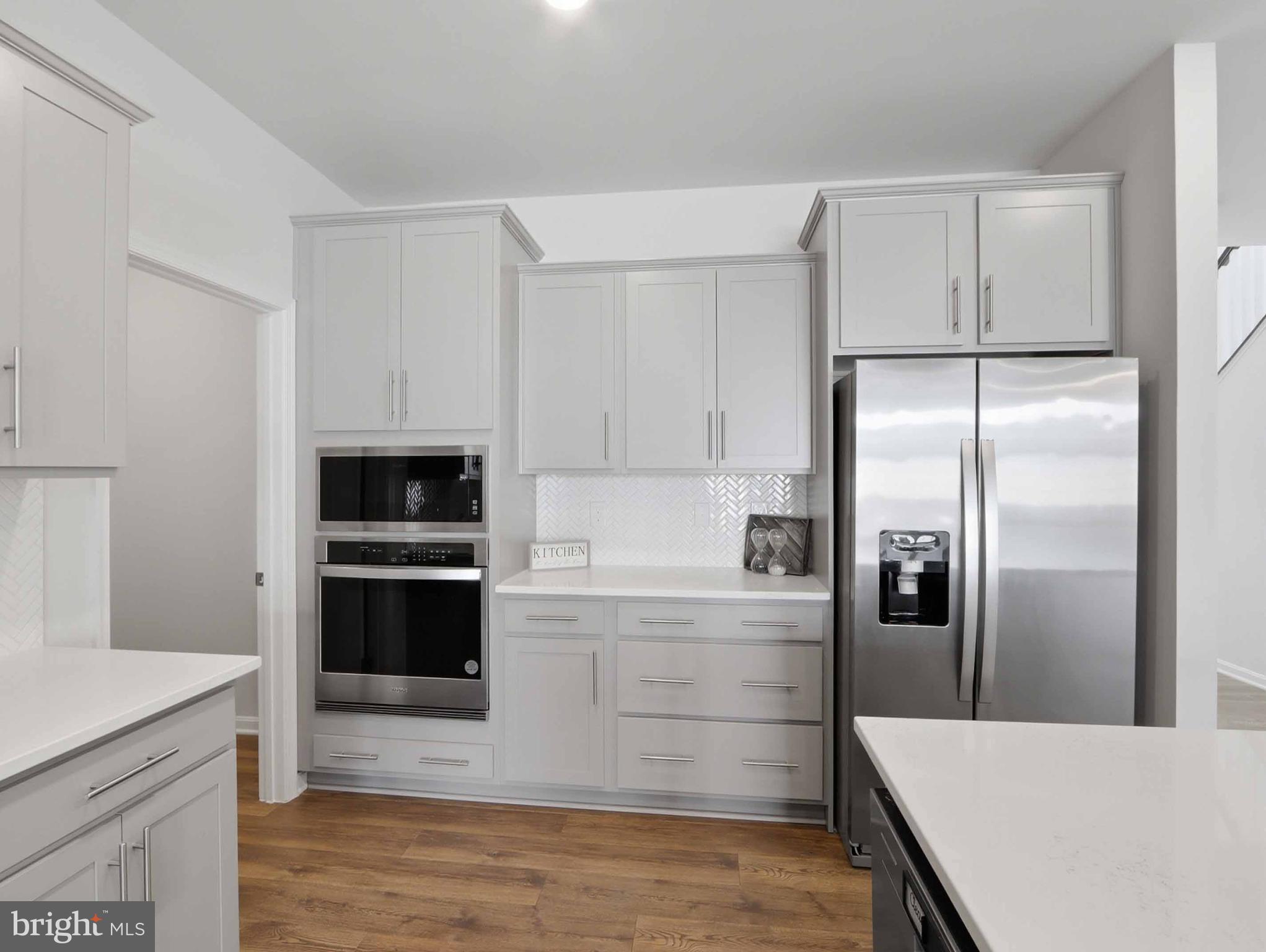 485 Hanson Street Frederick, MD 21701 - Photo 9 of 48 a kitchen with a refrigerator and a sink