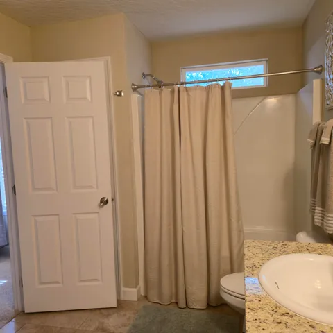 a patio with a yard table and chairs