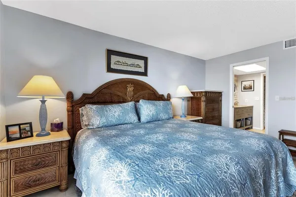 a bedroom with a bed and a table in it