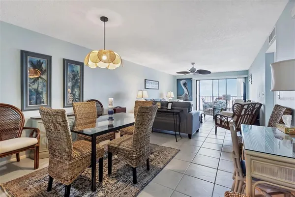 a living room with furniture a rug and a flat screen tv