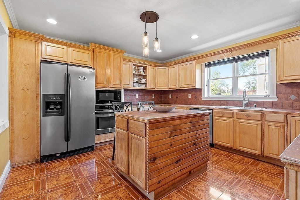 31 Booth Road Methuen, MA 01844 - Photo 12 of 38 a kitchen with granite countertop a sink appliances cabinets and a counter top space