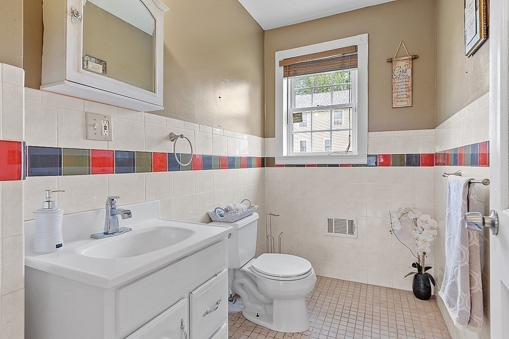 31 Booth Road Methuen, MA 01844 - Photo 14 of 38 a bathroom with a sink toilet and window
