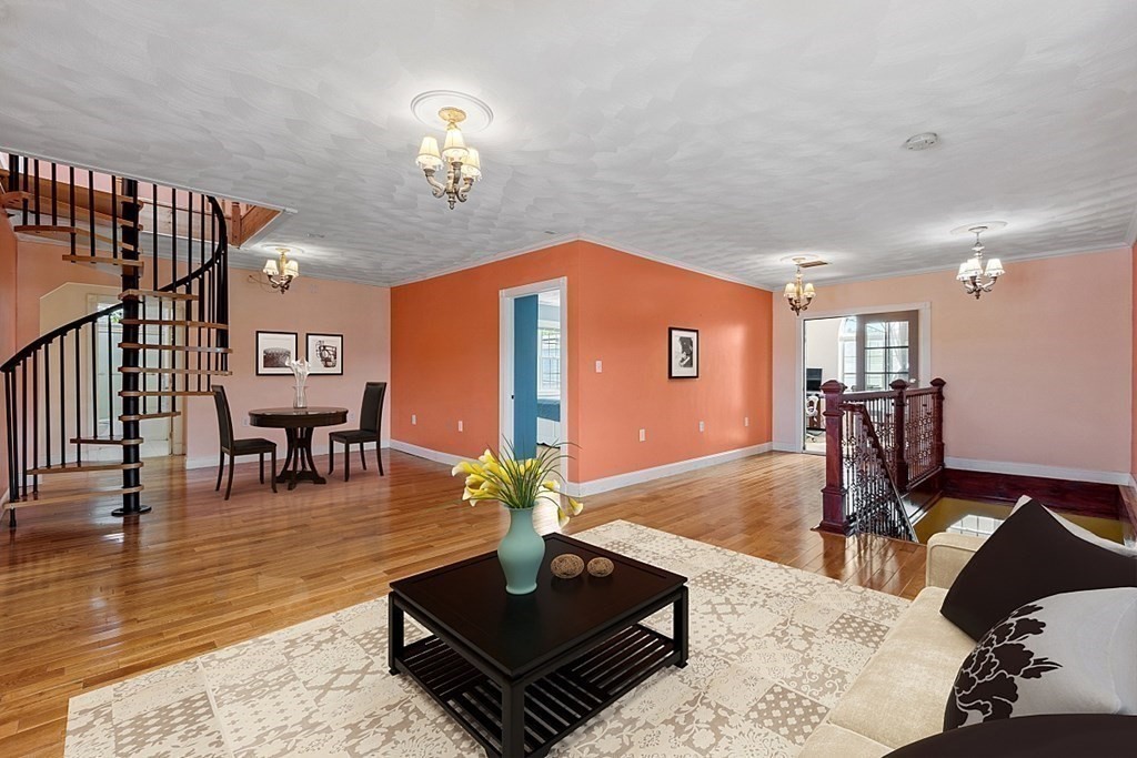 31 Booth Road Methuen, MA 01844 - Photo 15 of 38 a living room with fireplace furniture and a chandelier