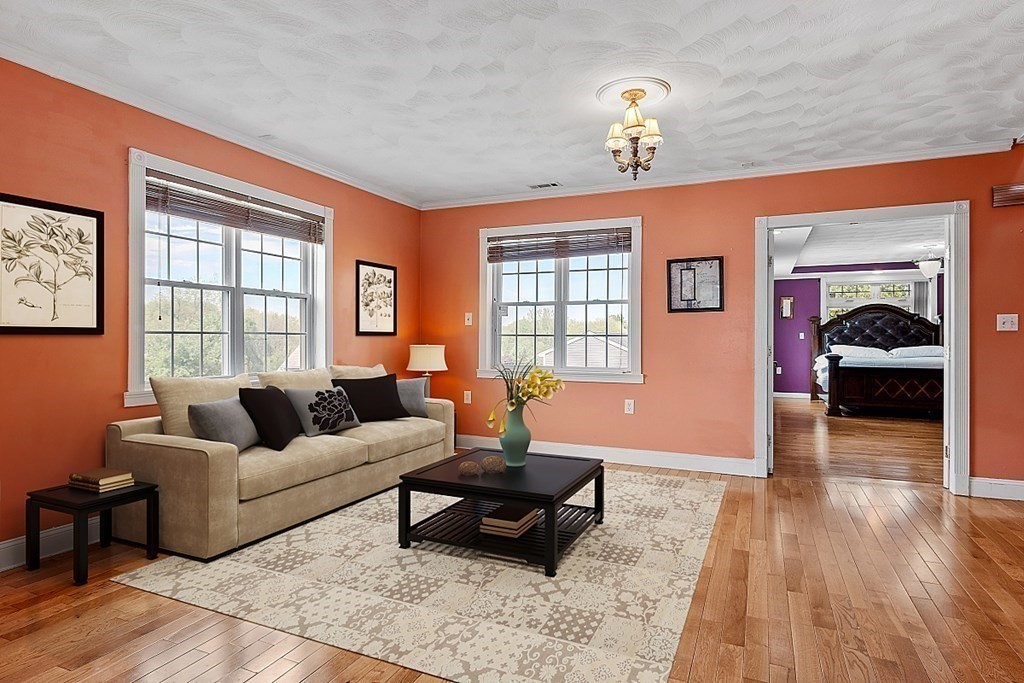 31 Booth Road Methuen, MA 01844 - Photo 16 of 38 a living room with furniture and a chandelier