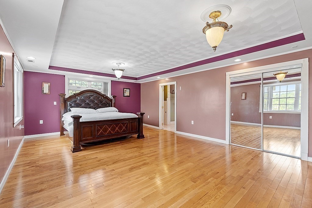 31 Booth Road Methuen, MA 01844 - Photo 18 of 38 a bedroom with a bed and ceiling fan