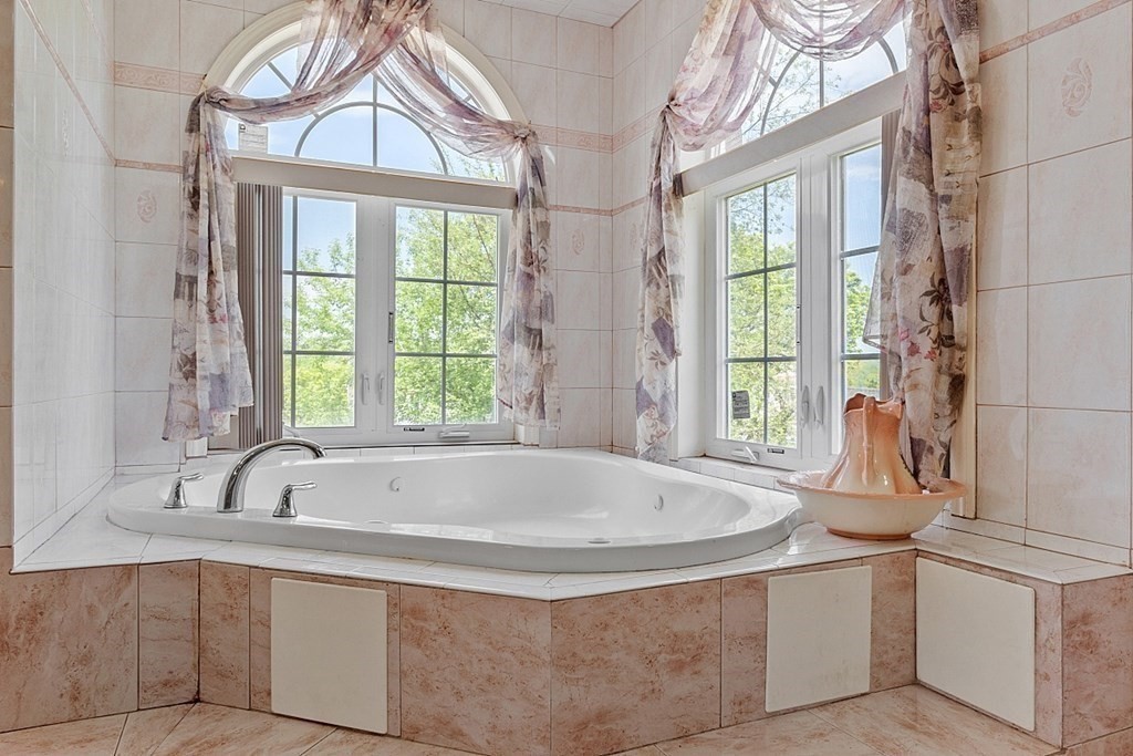 31 Booth Road Methuen, MA 01844 - Photo 21 of 38 a white bath tub sitting next to a window