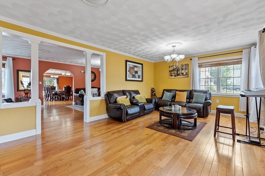 31 Booth Road Methuen, MA 01844 - Photo 5 of 38 a living room with furniture and a wooden floor