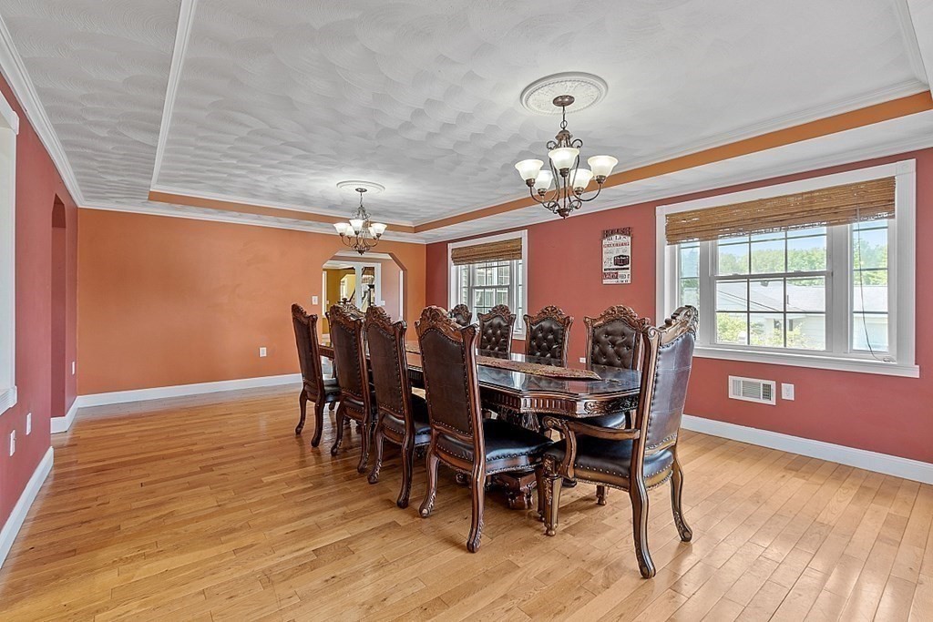 31 Booth Road Methuen, MA 01844 - Photo 8 of 38 a view of a dining room with furniture window and wooden floor
