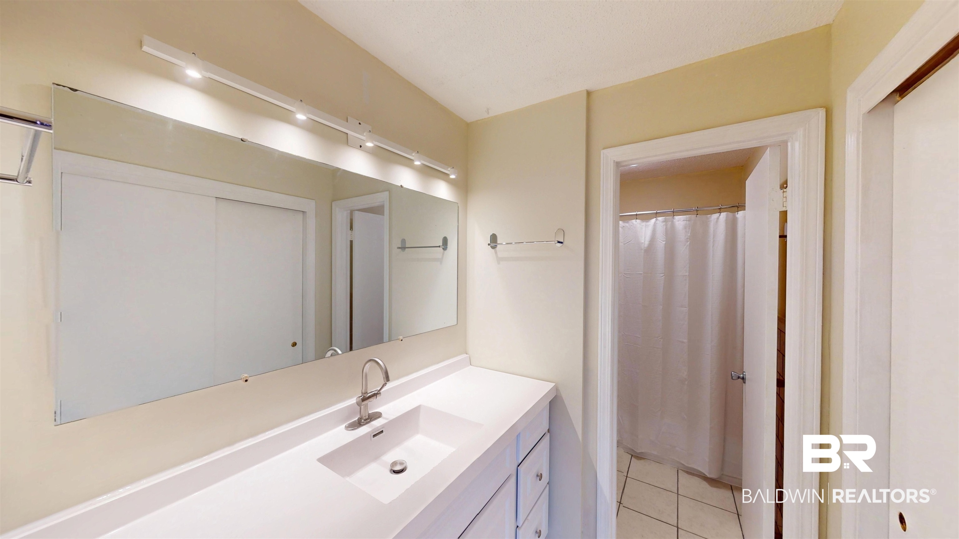 1471 Cedar Crescent Drive Mobile, AL 36605 - Photo 21 of 28 Full bath with curtained shower, vanity, and light tile patterned flooring
