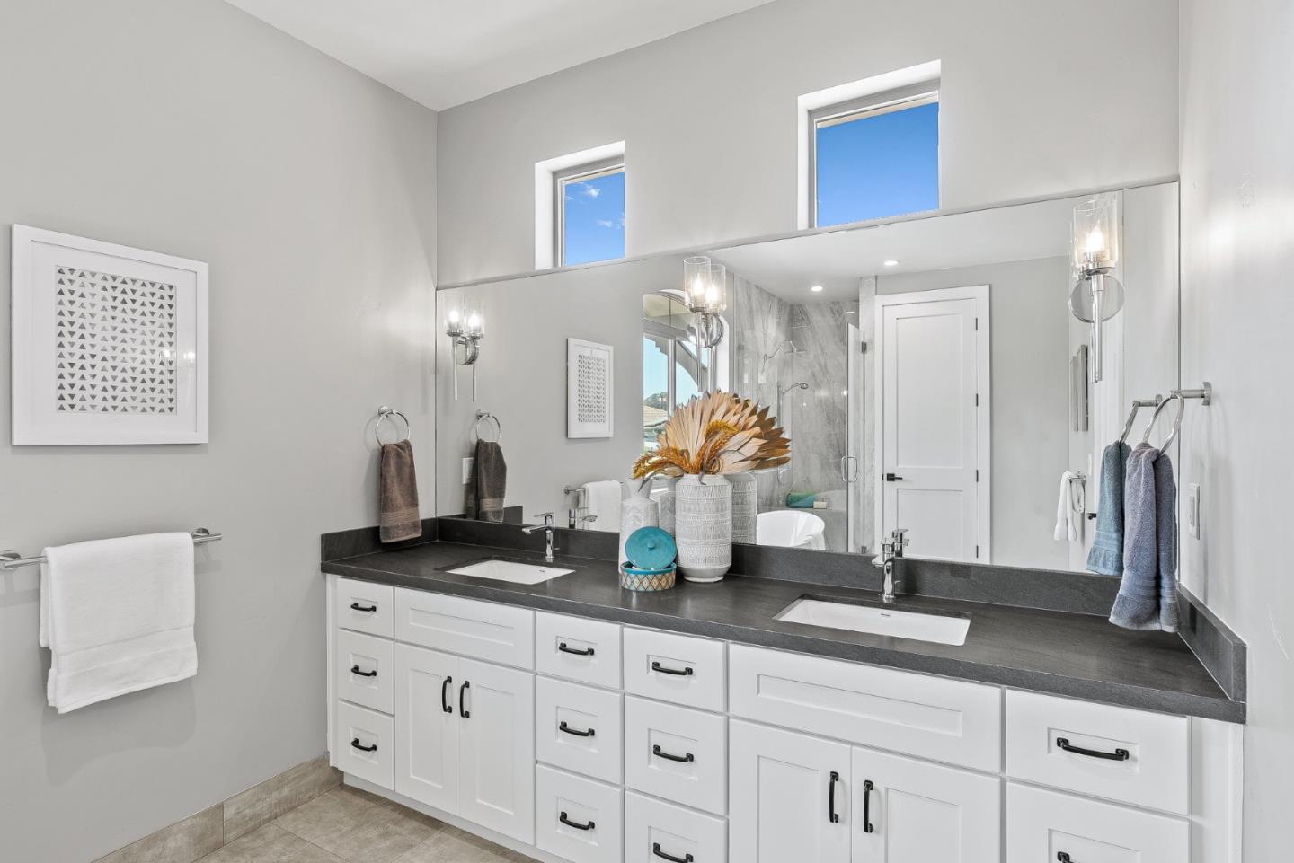 31 Indy Circle Soquel, CA 95073 - Photo 29 of 61 a bathroom with double vanity sinks a vanity a lamp and a mirror