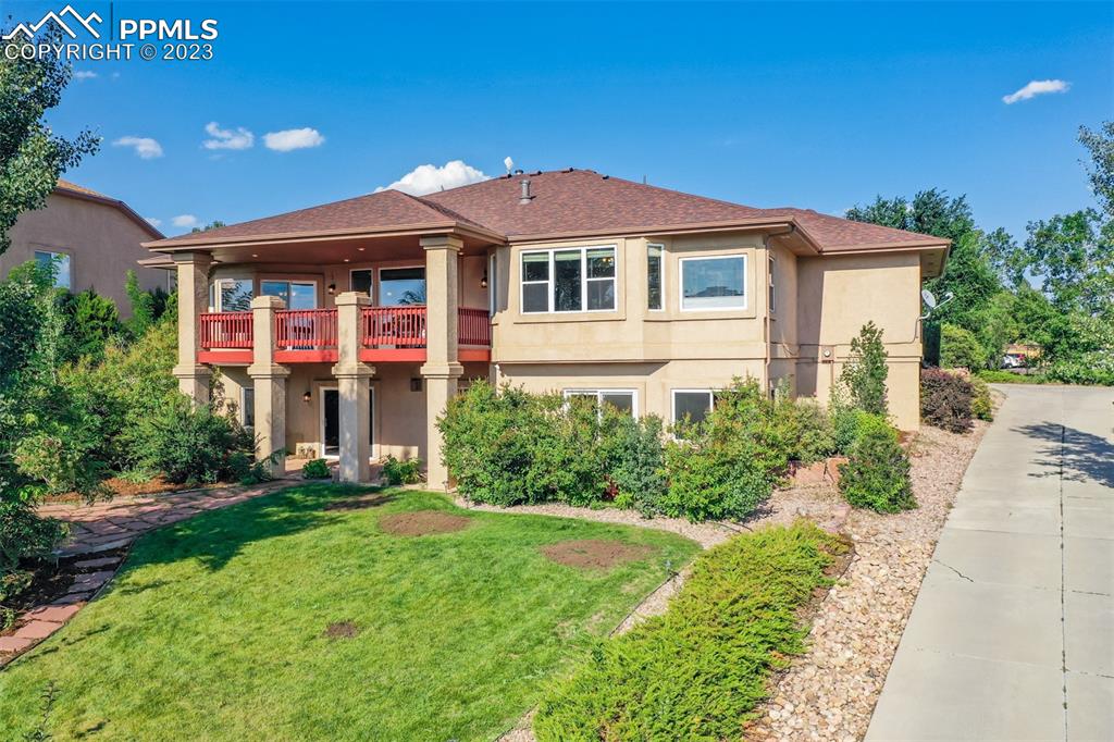 Magnificent home nestled on a hill with fabulous front and back yards!