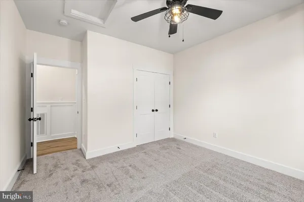 a bathroom with a toilet a sink and shower