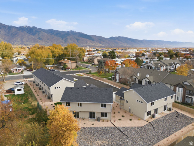 1615 North Angel Street, Unit H Layton, UT 84041 - Photo 44 of 55 Aerial view of residential area featuring a mountainous background