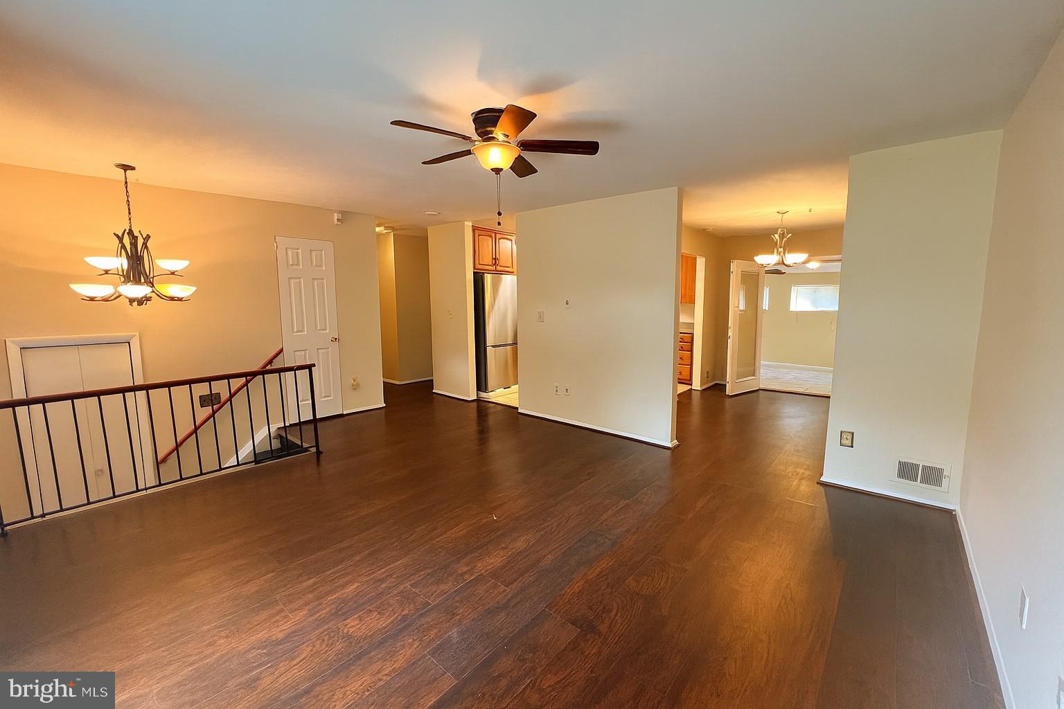 8702 Hamlin Street, Unit A Landover, MD 20785 - Photo 1 of 15 a view of a livingroom with wooden floor and a ceiling fan