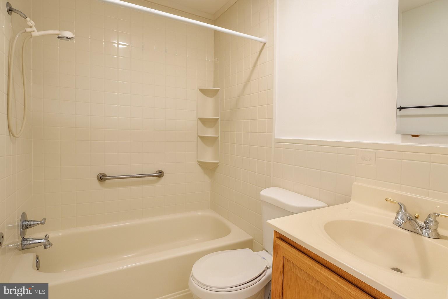 8702 Hamlin Street, Unit A Landover, MD 20785 - Photo 13 of 15 a bathroom with a sink toilet and shower