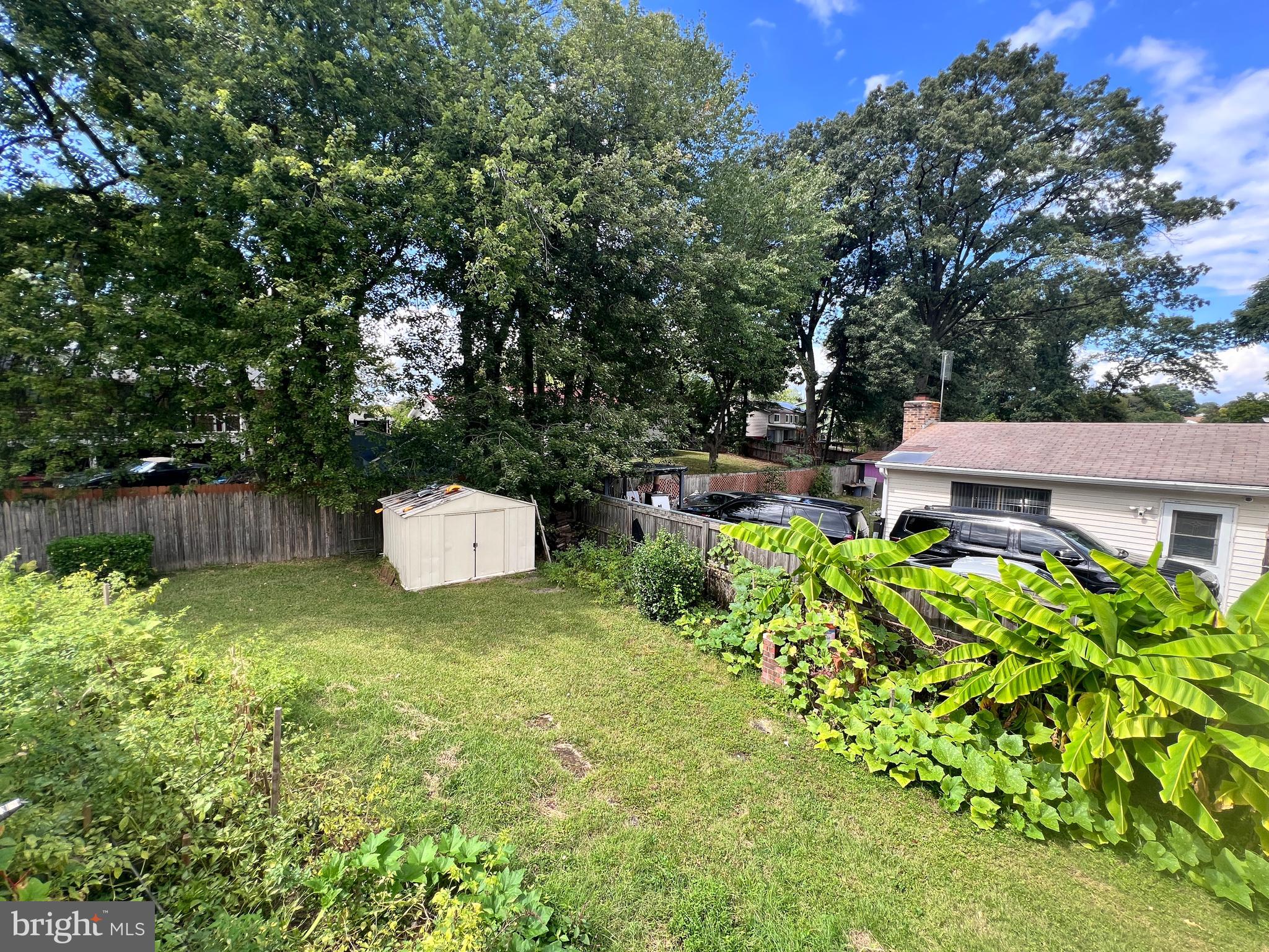 8702 Hamlin Street, Unit A Landover, MD 20785 - Photo 15 of 15 a backyard of a house with lots of green space and fountain