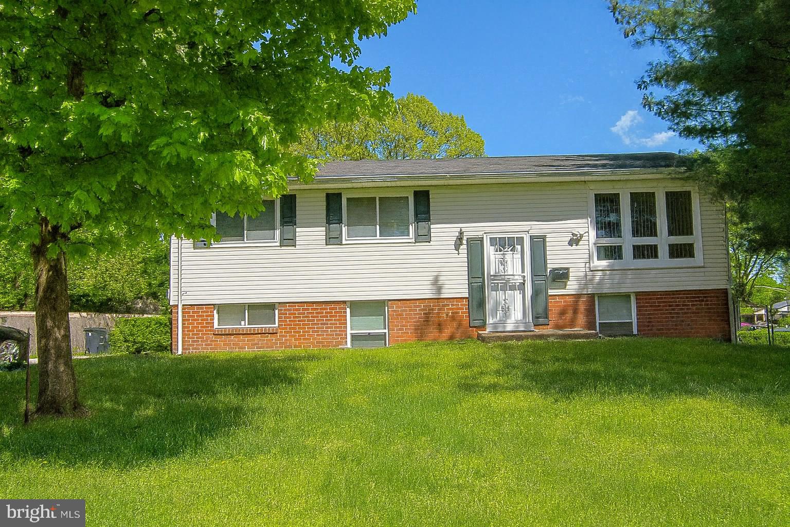 8702 Hamlin Street, Unit A Landover, MD 20785 - Photo 2 of 15 a front view of house with yard and green space