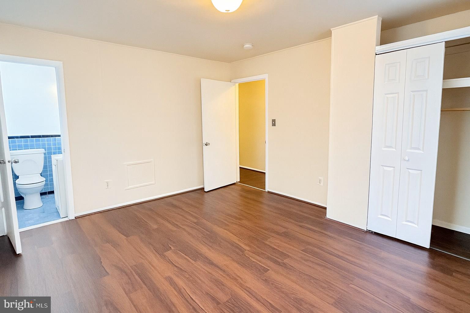8702 Hamlin Street, Unit A Landover, MD 20785 - Photo 10 of 15 a view of a room with wooden floor and bathroom view