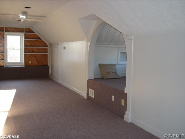 12011 Taplow Road Midlothian, VA 23112 - Photo 11 of 12 a room with a chair and a window