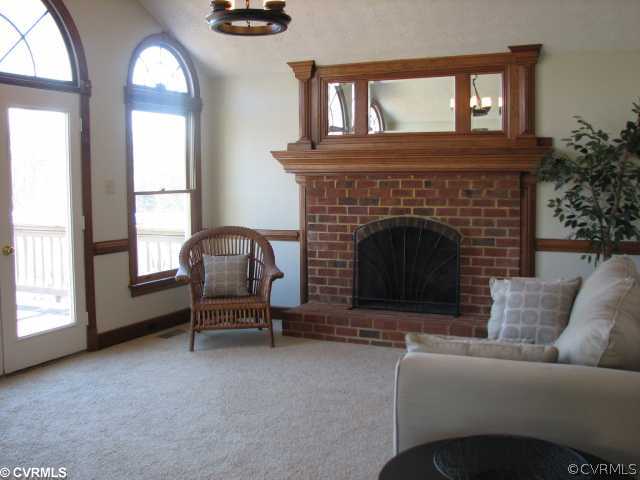 12011 Taplow Road Midlothian, VA 23112 - Photo 3 of 12 a living room with furniture and a fireplace