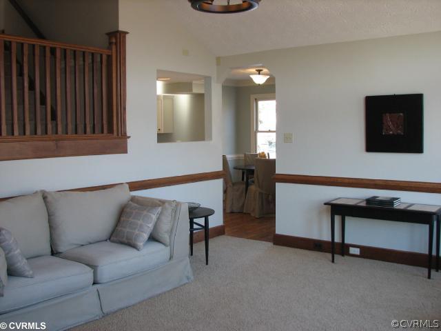 12011 Taplow Road Midlothian, VA 23112 - Photo 4 of 12 a living room with furniture and a flat screen tv