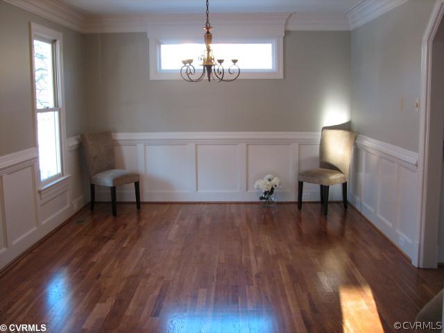 12011 Taplow Road Midlothian, VA 23112 - Photo 7 of 12 a view of a livingroom with furniture wooden floor and a chandelier