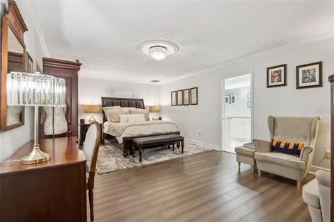 a bed room with a bed and a mirror